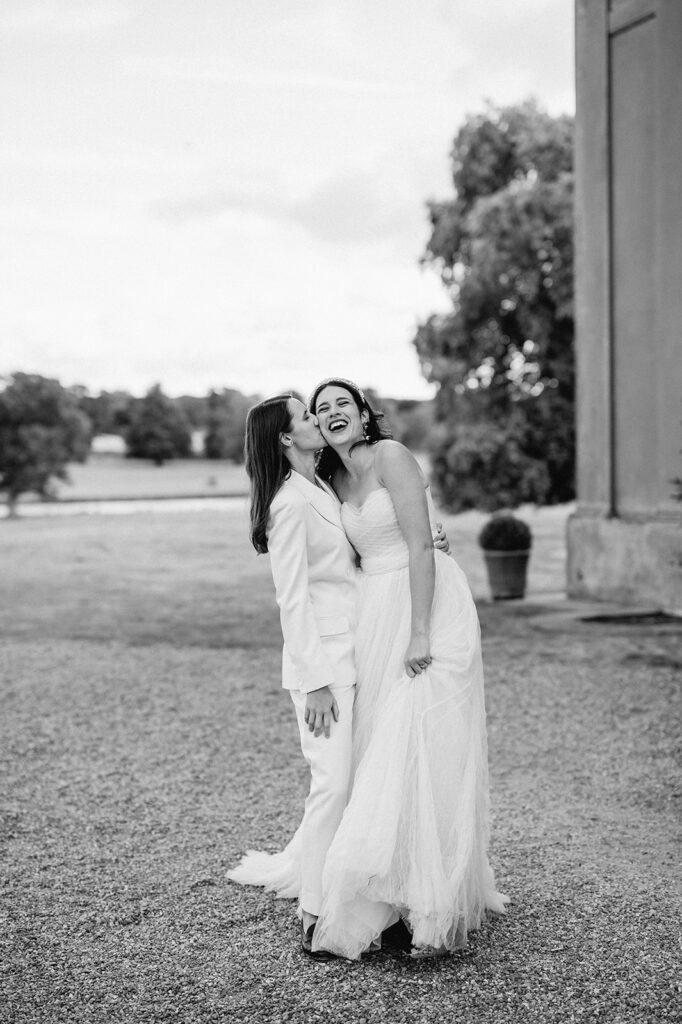 bride kissing her bride at wilderness reserve