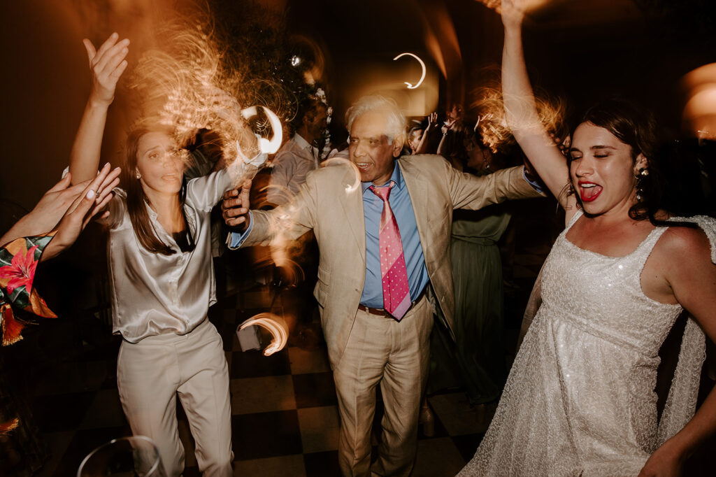 wedding guests dancing with shutter drag