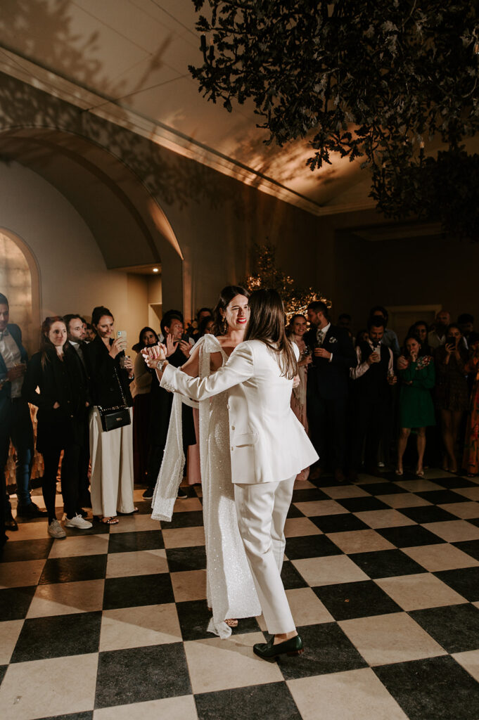 two brides having first dance at wedding in orangery at Sibton park