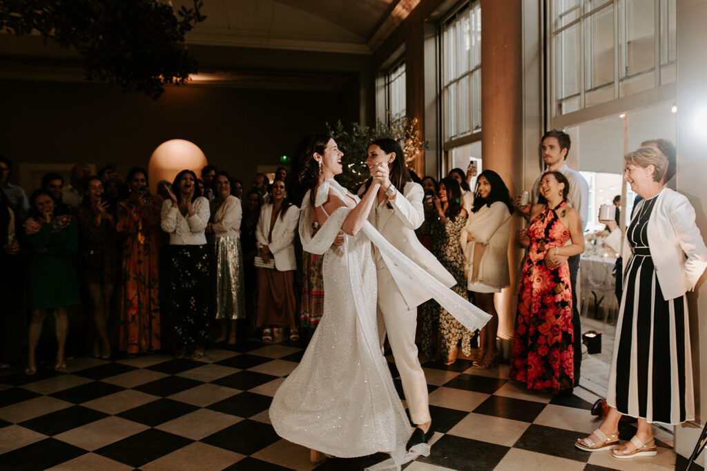 two brides having first dance in orangery at wilderness reserve