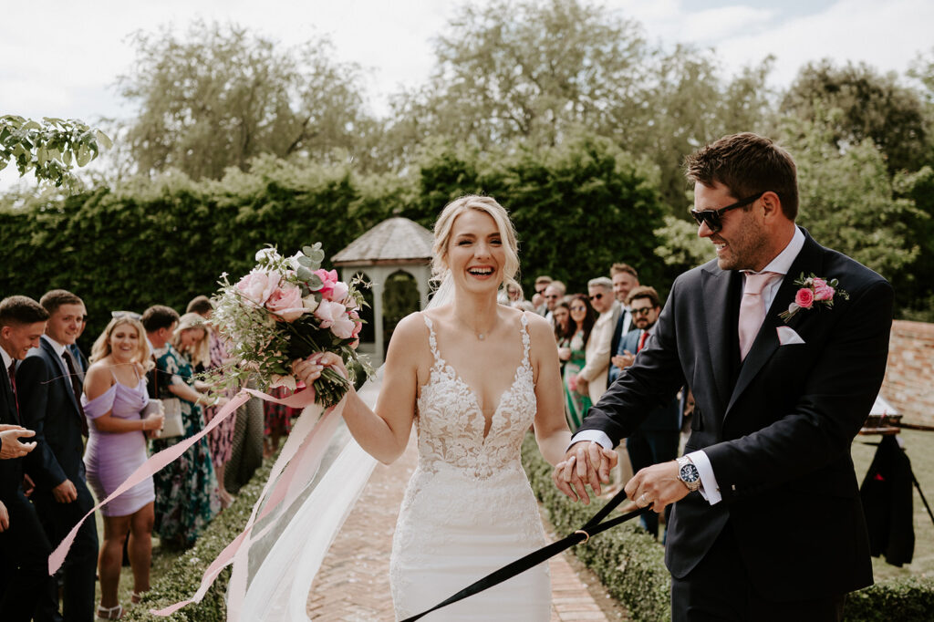 couple walking back down aisle at retreat east
