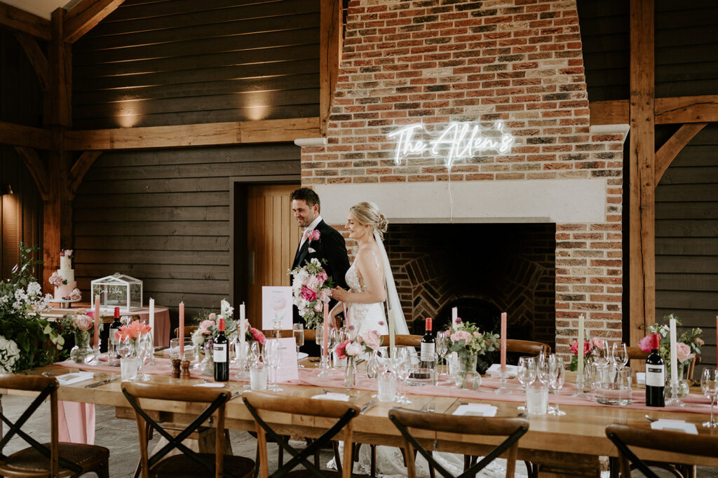 couple walking round reception room at retreat east
