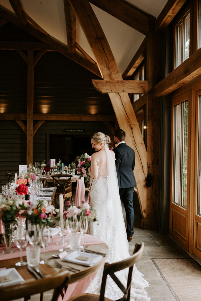 couple walking round reception room at retreat east