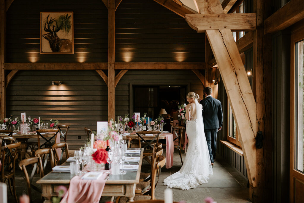 couple walking round reception room at retreat east