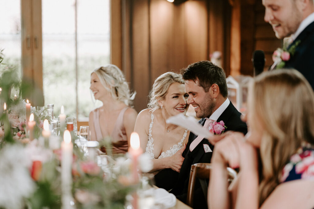 couple reaction to speeches at retreat east wedding