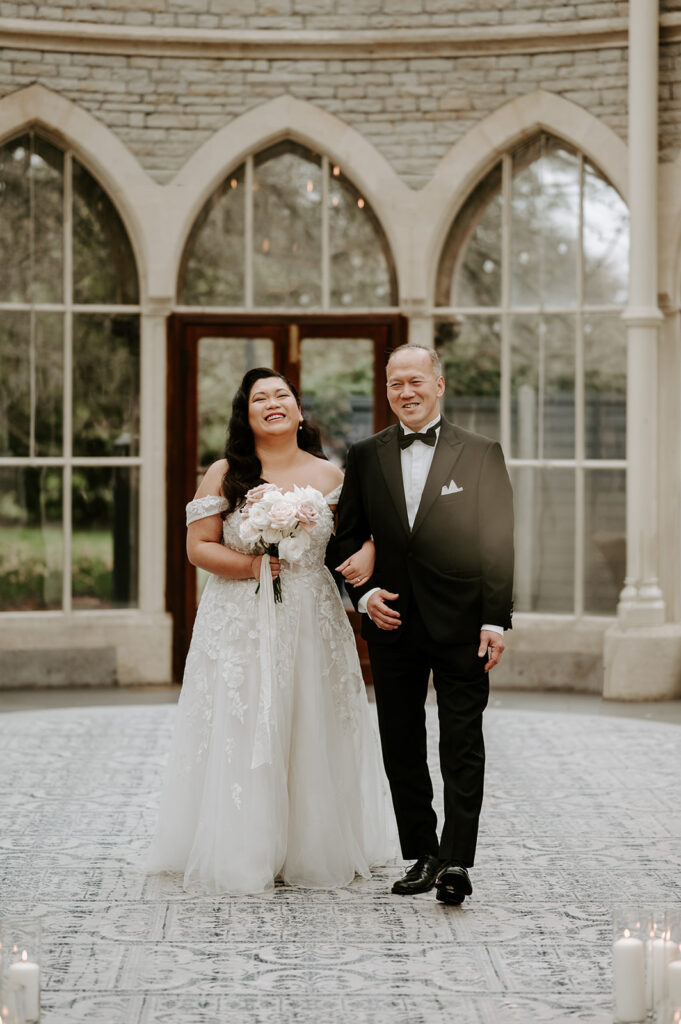 bride and father walking down the aisle at tortworth court
