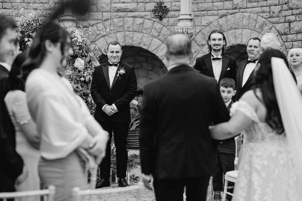groom first look of bride