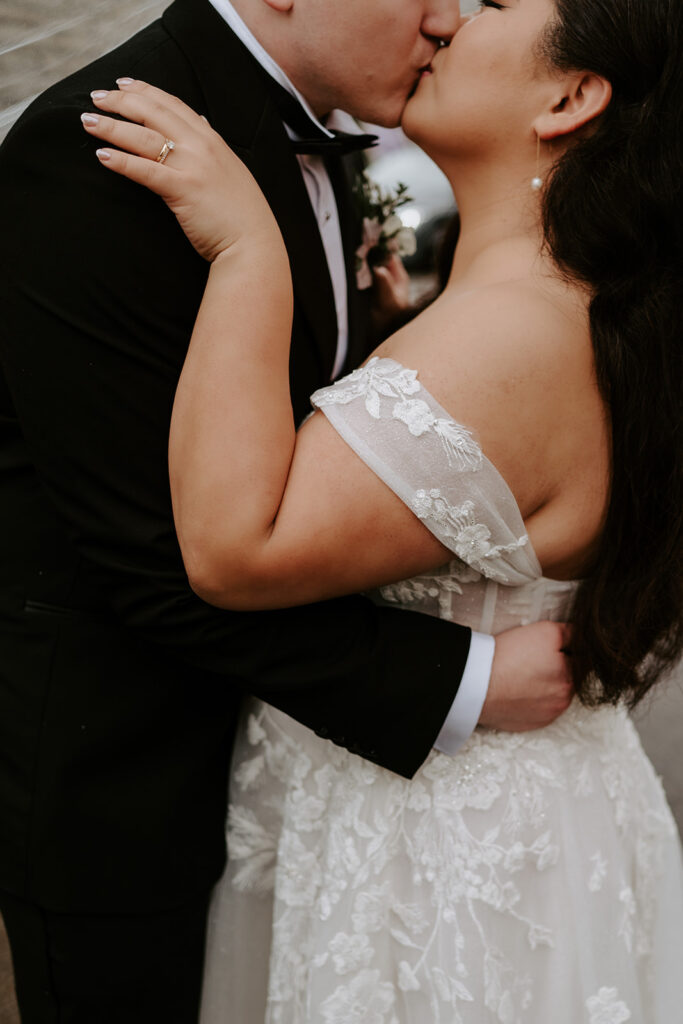 bride and groom sharing a kiss
