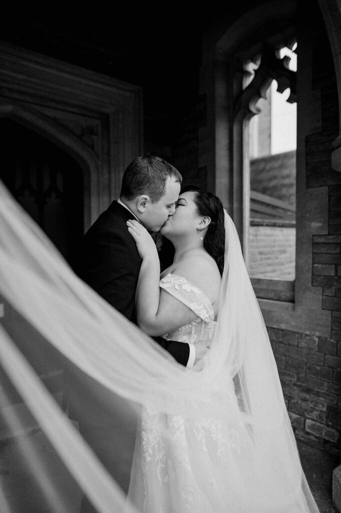 bride and groom with veil