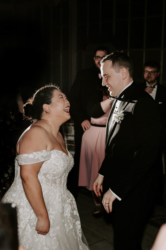 bride dancing with groom on dance floor at tortworth court
