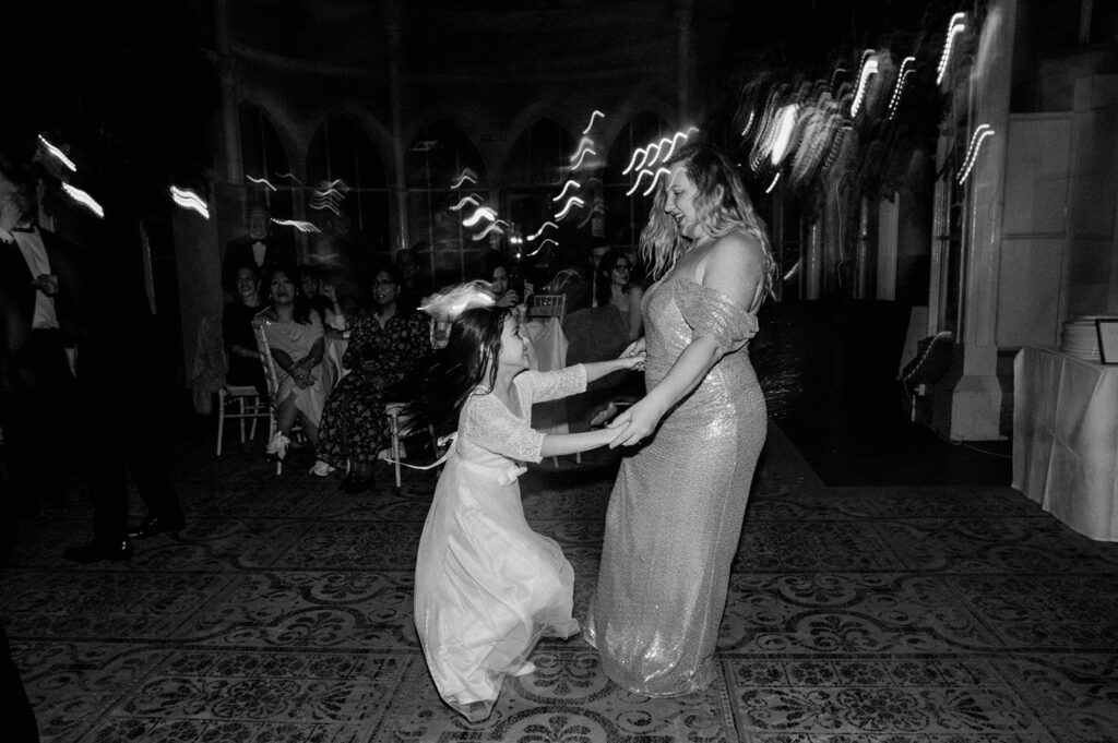 flower girl dancing on dance floor at tortworth court