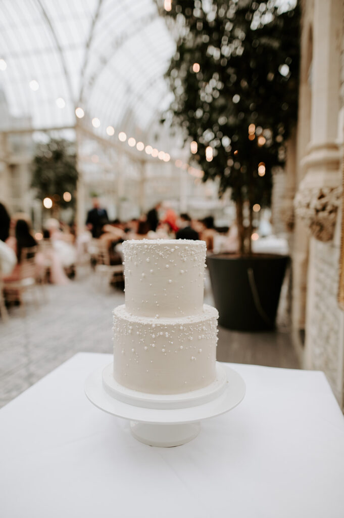 two tier wedding cake with pearls in orangery