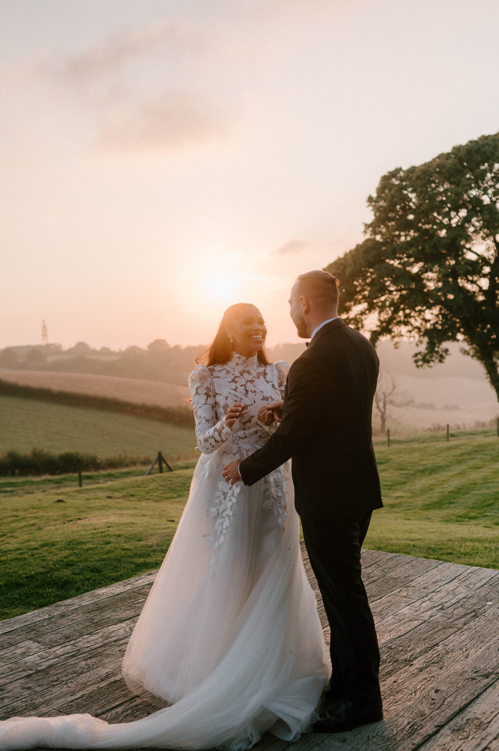 couple laughing at sunset botley hill barn