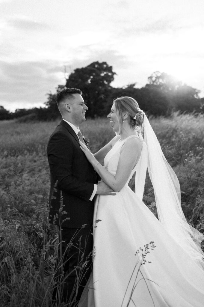 bride smiling joyfully at groom at bruisyard hall