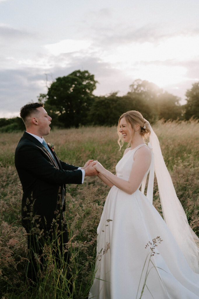bride and groom sharing a candid moment at bruisyard hall