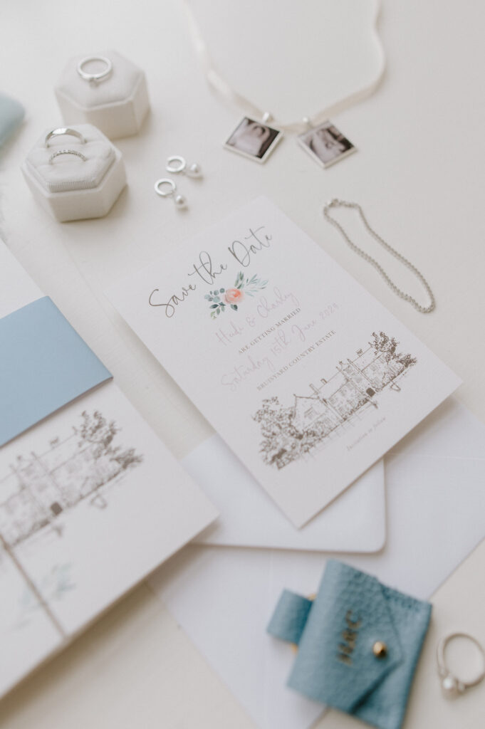 Flat lay of wedding stationery and details