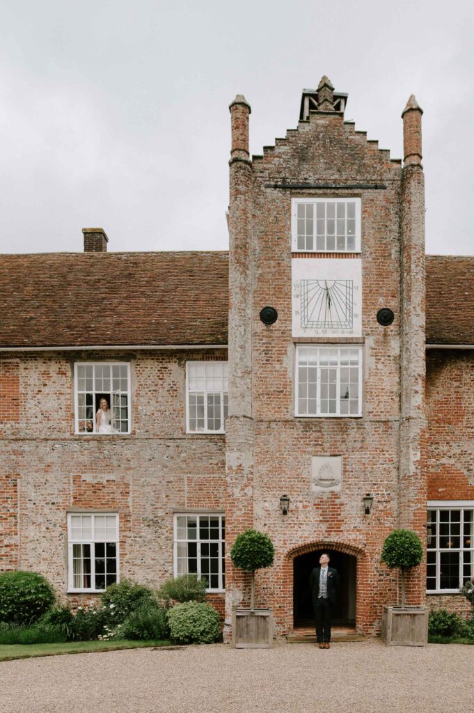 Exterior of Bruisyard Hall wedding venue in Suffolk on a bright summer wedding day