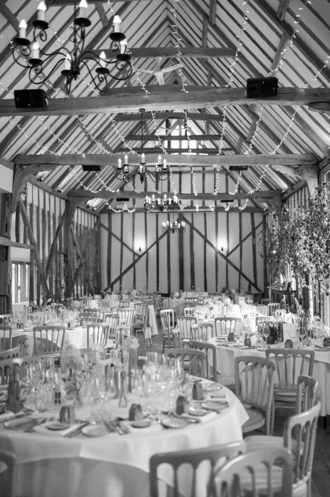 Wide view of the wedding breakfast room set up at Bruisyard Hall