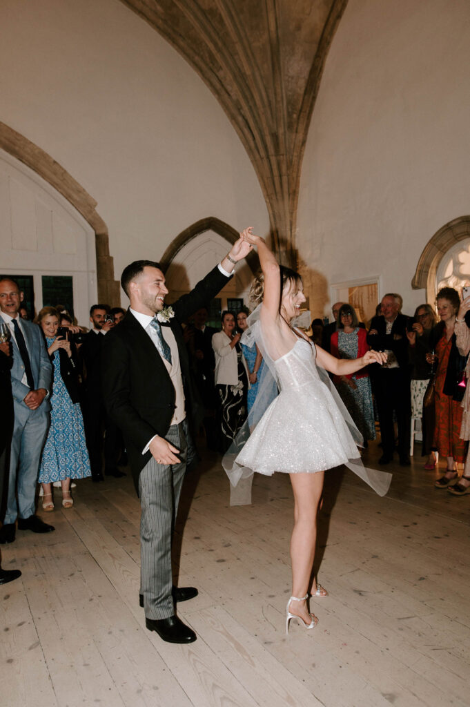Bride and groom dancing together during the evening reception.