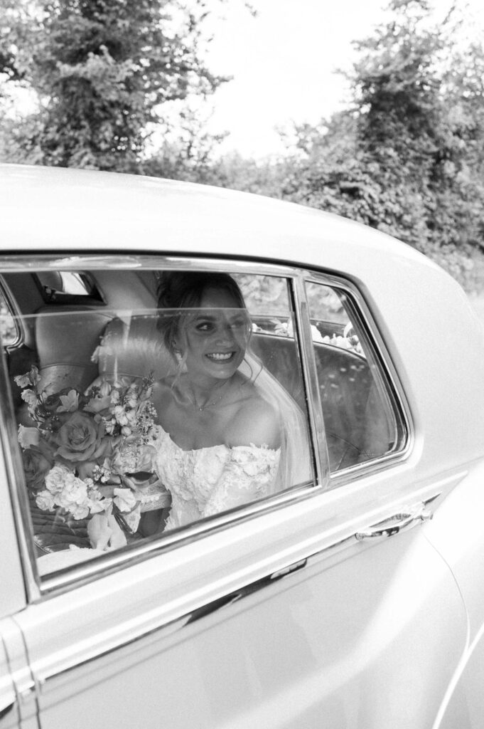 bride looking out of window about to get married at the church