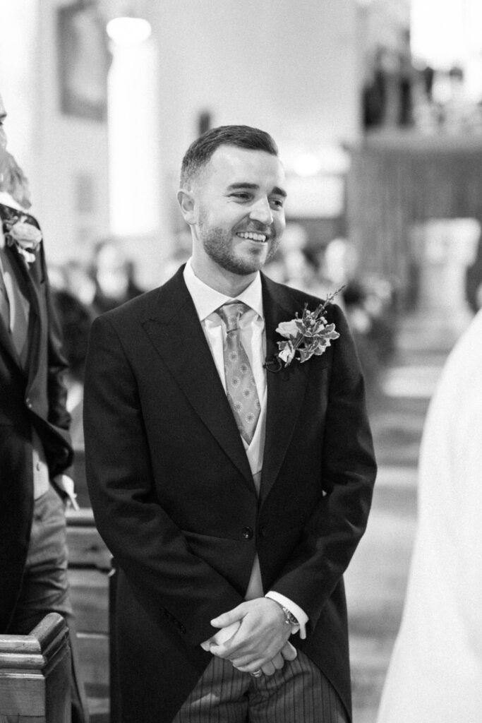 groom waiting at alter of the church