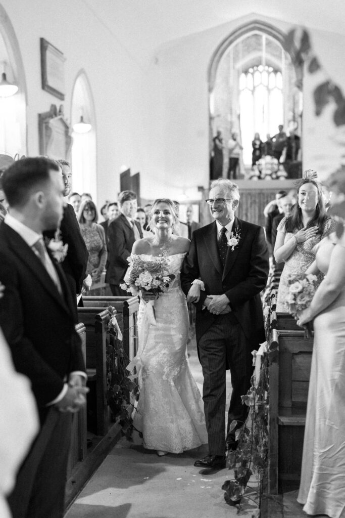 bride and her father walking down the aisle