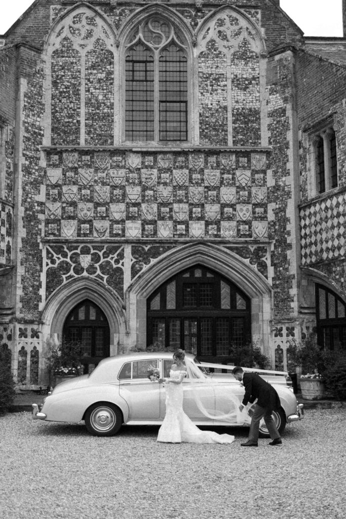 Vintage wedding car parked outside Butley Priory after the ceremony.