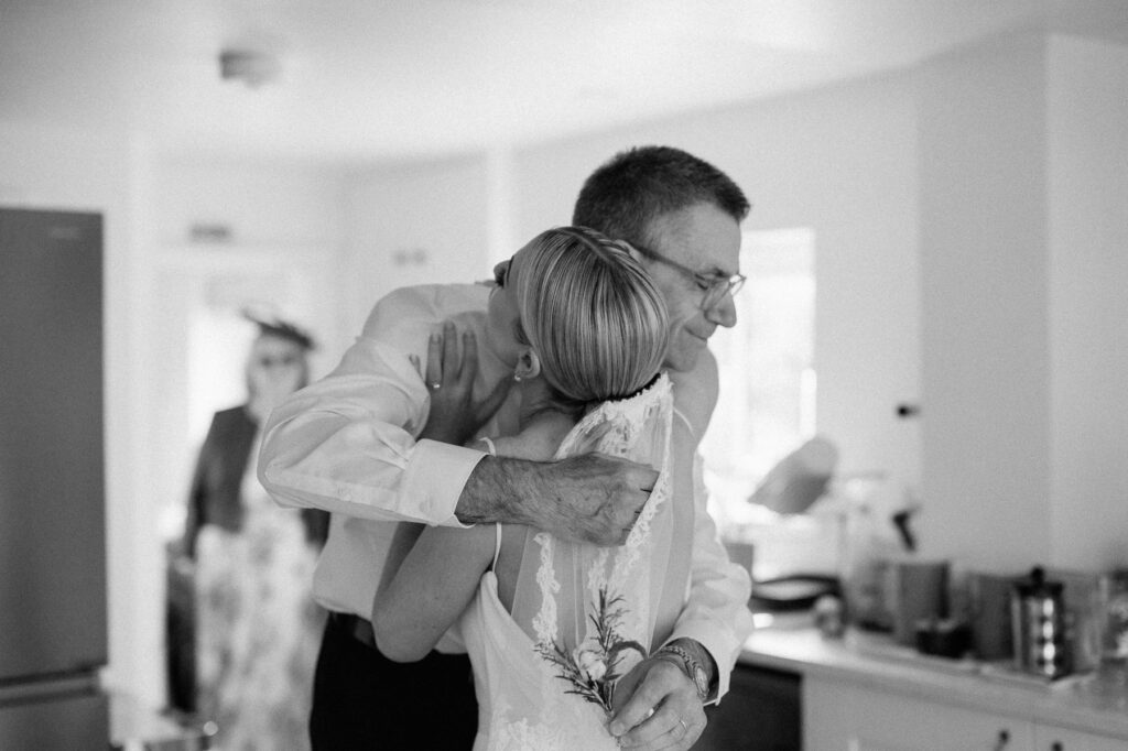 father of bride seeing bride for first time on wedding morning