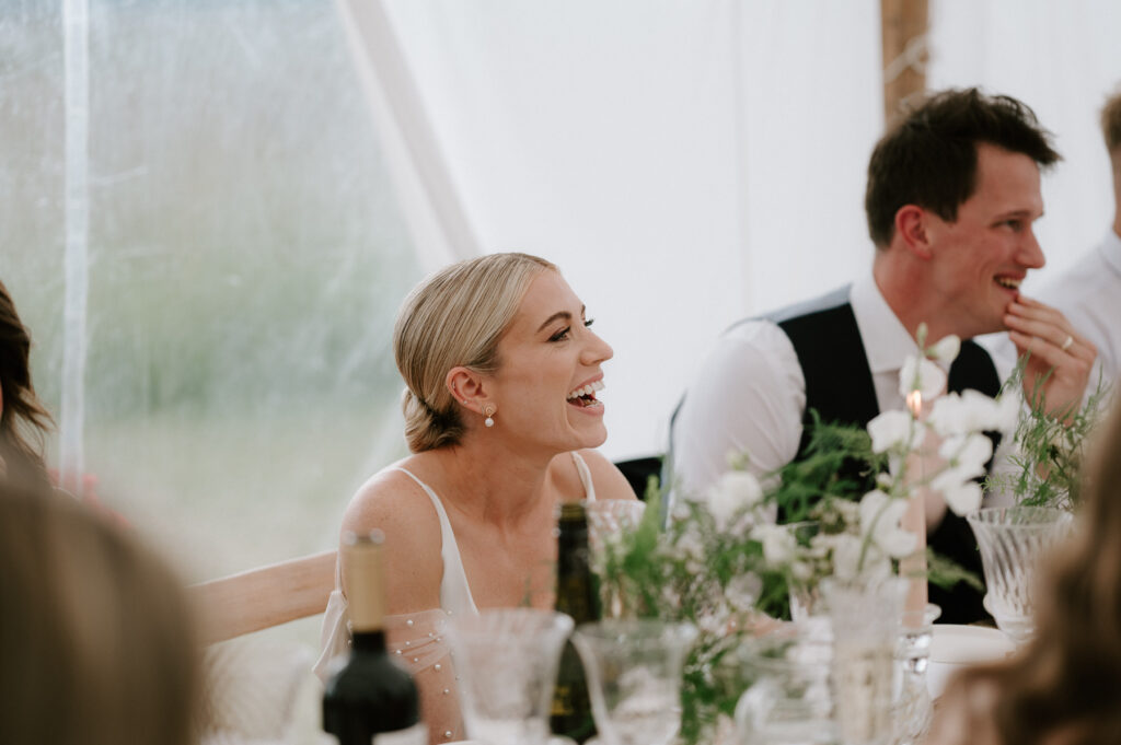 bride laughing at speeches